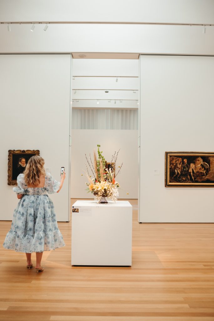 Woman in PNC NCMA Art in Bloom in Selkie La Belle Etoile French Puff Dress