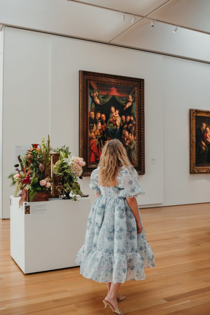 Woman in PNC NCMA Art in Bloom in Selkie La Belle Etoile French Puff Dress