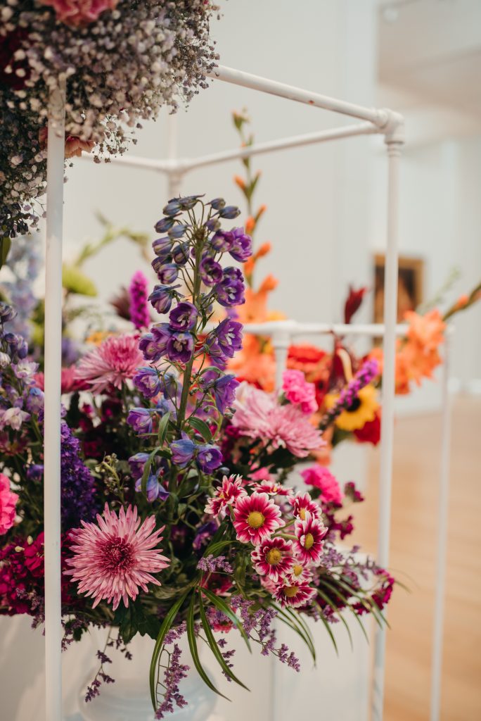Woman in PNC NCMA Art in Bloom in Selkie La Belle Etoile French Puff Dress