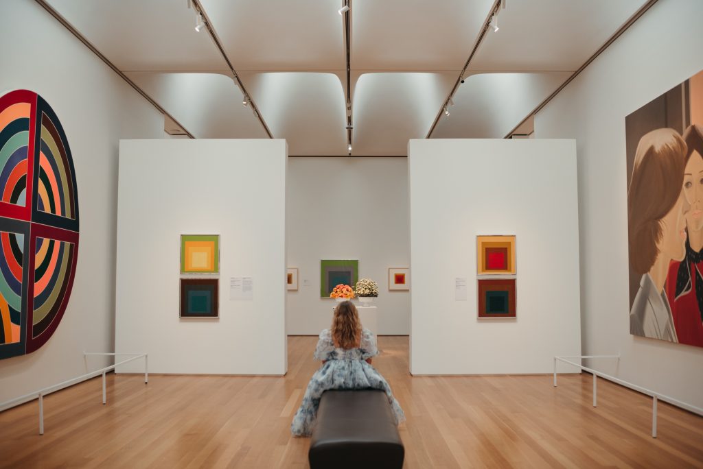 Woman in PNC NCMA Art in Bloom in Selkie La Belle Etoile French Puff Dress